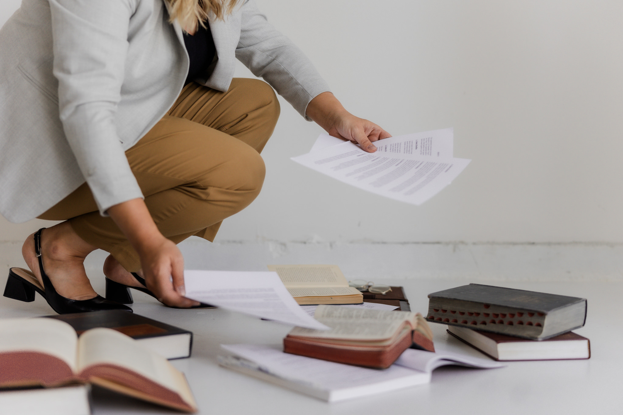 Lawyer reviewing paperwork on the floor