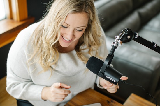 Image of Attorney in front of a podcast mic